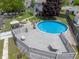 Aerial view of backyard with above-ground pool, deck, patio, and surrounding landscaping at 925 Mallory Pkwy, Franklin, IN 46131