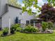 Landscaped backyard featuring a deck, pergola, and lush greenery, offering an inviting outdoor space at 925 Mallory Pkwy, Franklin, IN 46131