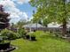 Expansive backyard showcasing a well-maintained lawn and beautiful landscaping at 925 Mallory Pkwy, Franklin, IN 46131