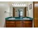 Bathroom featuring a double sink with a large mirror reflecting the bedroom beyond at 925 Mallory Pkwy, Franklin, IN 46131