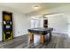 Spacious bonus room featuring new floors, a pool table, and an Arachnid electronic dartboard at 925 Mallory Pkwy, Franklin, IN 46131