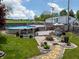 Backyard featuring an above-ground pool with surrounding deck, patio with fire pit, and open green space at 925 Mallory Pkwy, Franklin, IN 46131