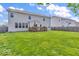Large, well-maintained backyard with a spacious deck, perfect for outdoor entertaining at 9712 Brooks Dr, McCordsville, IN 46055