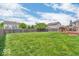 Spacious, fenced backyard with lush green grass, offering privacy and room for recreation at 9712 Brooks Dr, McCordsville, IN 46055