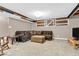 Finished basement with comfortable seating area and unique barn door detail at 9712 Brooks Dr, McCordsville, IN 46055