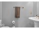 Neutral toned half-bathroom features a modern sink and fixtures with a towel bar at 9712 Brooks Dr, McCordsville, IN 46055