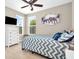 Comfortable bedroom featuring a ceiling fan, natural light, and calming elephant artwork at 9712 Brooks Dr, McCordsville, IN 46055