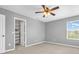 Bedroom with a ceiling fan and views from the window and a door leading to a closet at 9712 Brooks Dr, McCordsville, IN 46055