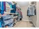 Walk-in closet with built-in shelving and ample space for clothing and storage at 9712 Brooks Dr, McCordsville, IN 46055