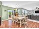Dining room with sliding glass doors leading to outdoor space, and a view of the living room and kitchen at 9712 Brooks Dr, McCordsville, IN 46055