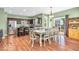 Well-lit dining area with sleek, stainless steel appliances and access to the outdoor patio at 9712 Brooks Dr, McCordsville, IN 46055