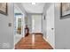 Elegant entryway featuring hardwood floors, neutral paint and white trim at 9712 Brooks Dr, McCordsville, IN 46055