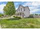 Well-maintained home featuring a lush green lawn, tidy landscaping, and a classic two-story design at 9712 Brooks Dr, McCordsville, IN 46055