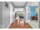 Inviting entryway with hardwood floors and views into the living room and office at 9712 Brooks Dr, McCordsville, IN 46055