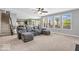 Bright living area with large windows, carpeted floors and a sectional couch, creating a comfortable atmosphere at 9712 Brooks Dr, McCordsville, IN 46055