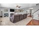 Inviting living room boasts a cozy fireplace and plush seating, perfect for relaxing and entertaining guests at 9712 Brooks Dr, McCordsville, IN 46055