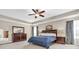 Spacious primary bedroom with tray ceiling, plush carpet, and elegant decor at 9712 Brooks Dr, McCordsville, IN 46055