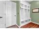 Inviting mudroom features built-in cubbies and a convenient entrance from the exterior at 9712 Brooks Dr, McCordsville, IN 46055