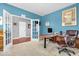 Home office with french doors, neutral carpet, computer desk, and comfortable leather office chair at 9712 Brooks Dr, McCordsville, IN 46055