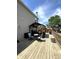 Backyard deck featuring a covered seating area, ideal for outdoor entertaining and relaxation at 98 Frostwood Ln, Greenwood, IN 46143