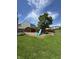 A well maintained lawn includes a swing set and a wooden shed at 98 Frostwood Ln, Greenwood, IN 46143
