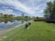 A beautiful backyard with pond access and a trampoline at 98 Frostwood Ln, Greenwood, IN 46143