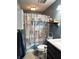 Charming bathroom featuring a beach-themed shower curtain and vanity with a white marble countertop at 98 Frostwood Ln, Greenwood, IN 46143