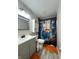Unique bathroom showcasing a cat-themed shower curtain, modern vanity, and tiled flooring at 98 Frostwood Ln, Greenwood, IN 46143