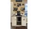 Coffee bar featuring a coffee maker, decor, counterspace and storage at 98 Frostwood Ln, Greenwood, IN 46143