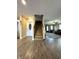 Open-concept entryway with hardwood flooring and staircase at 98 Frostwood Ln, Greenwood, IN 46143