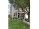 Charming two-story home featuring neutral siding, black shutters, and a well-maintained front yard with mature trees at 98 Frostwood Ln, Greenwood, IN 46143