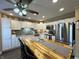 Bright kitchen with stainless steel appliances, white cabinets, kitchen island with seating and modern decor at 98 Frostwood Ln, Greenwood, IN 46143
