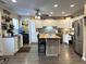 Bright kitchen with white cabinets, stainless steel appliances, and a central island with seating at 98 Frostwood Ln, Greenwood, IN 46143