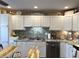 Bright kitchen with white cabinets, stainless steel appliances, and granite countertops at 98 Frostwood Ln, Greenwood, IN 46143