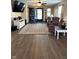 Inviting living room with hardwood floors, ceiling fan, and plenty of natural light at 98 Frostwood Ln, Greenwood, IN 46143