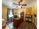 Spacious office with wood floors, a wooden desk, and natural lighting from a window at 98 Frostwood Ln, Greenwood, IN 46143