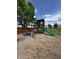 Backyard playground with slide, swing, sandbox, and playhouse, perfect for Gathering fun at 98 Frostwood Ln, Greenwood, IN 46143