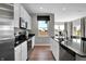 Bright kitchen with sleek countertops, modern appliances, and seamless transition into the living area at 10817 Soda Creek Ct, Indianapolis, IN 46239