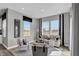 Bright living room featuring neutral furniture, modern decor, and large windows offering ample natural light at 10817 Soda Creek Ct, Indianapolis, IN 46239