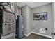 Efficient utility room featuring a water heater, furnace and stylish tile floor at 10817 Soda Creek Ct, Indianapolis, IN 46239