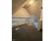 Attic area with view of staircase and small window at 1131 S Pershing Ave, Indianapolis, IN 46221