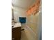 Traditional bathroom featuring pink accents, light tile walls, vanity, and shower at 1131 S Pershing Ave, Indianapolis, IN 46221