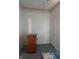 A bedroom featuring patterned border trim, a wood dresser, and blue carpeting at 1131 S Pershing Ave, Indianapolis, IN 46221