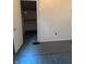 View of a bedroom closet featuring wood shelving and hanging clothes at 1131 S Pershing Ave, Indianapolis, IN 46221