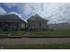 This is a full front exterior view of a single-Gathering residence with a cozy front porch at 1131 S Pershing Ave, Indianapolis, IN 46221