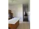 This kitchen has an island, utility ladder, and a view into a living room with a fireplace at 1131 S Pershing Ave, Indianapolis, IN 46221