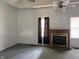 This living room features a fireplace, natural lighting, and a ceiling fan at 1131 S Pershing Ave, Indianapolis, IN 46221