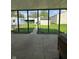 View from the screened patio to the backyard and a few outbuildings at 1131 S Pershing Ave, Indianapolis, IN 46221
