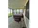 Screened patio with a wood-sided hot tub on a concrete surface with steps at 1131 S Pershing Ave, Indianapolis, IN 46221