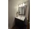 Bathroom featuring a framed mirror, modern vanity, and updated lighting at 11506 Hidden Bay, Indianapolis, IN 46236